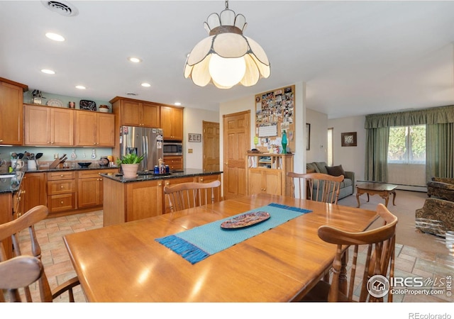 dining room with visible vents, a baseboard radiator, stone tile flooring, and recessed lighting