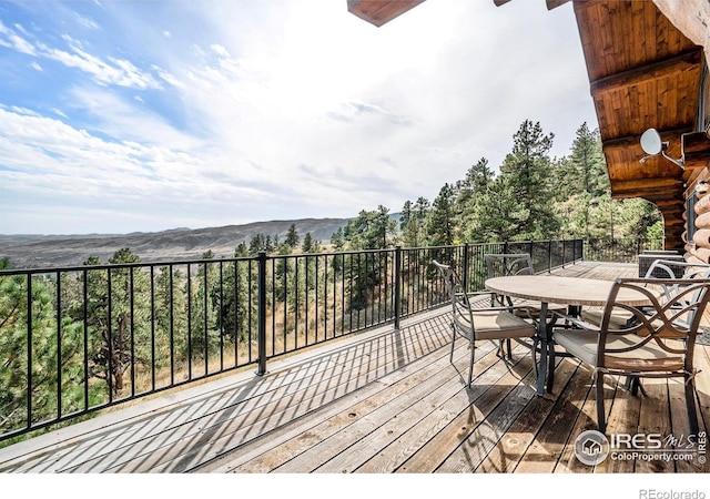 wooden deck featuring a mountain view