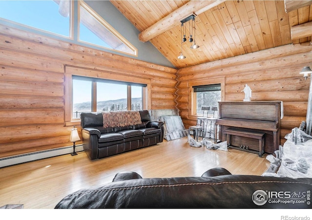 living room with a mountain view, beam ceiling, light hardwood / wood-style floors, and wooden ceiling