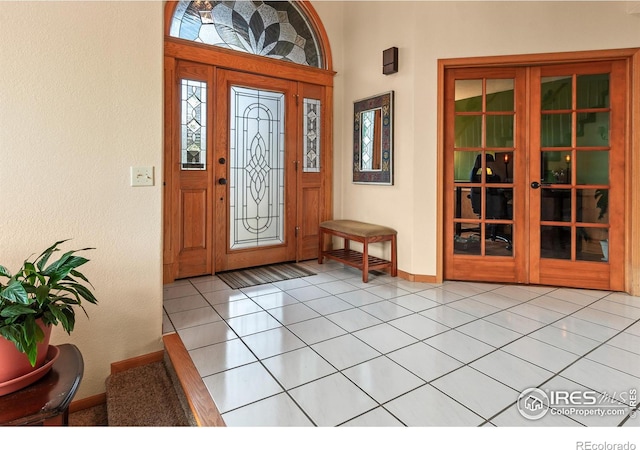 entrance foyer featuring light tile patterned floors