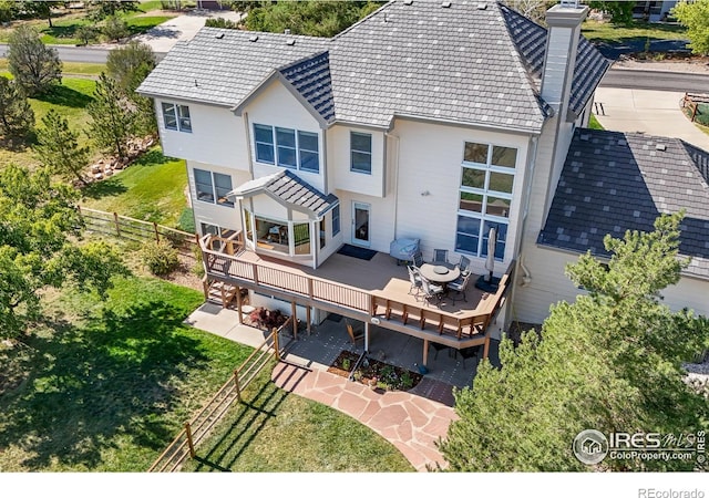 rear view of house with a deck and a patio area