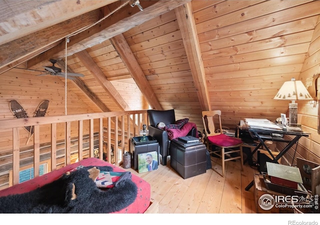 interior space with light wood-type flooring, wood ceiling, ceiling fan, vaulted ceiling with beams, and wood walls