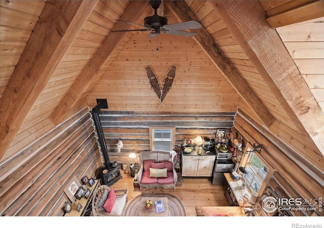 unfurnished living room with hardwood / wood-style floors, ceiling fan, wood walls, and wood ceiling