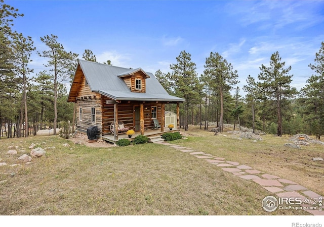 exterior space with a front lawn and a porch