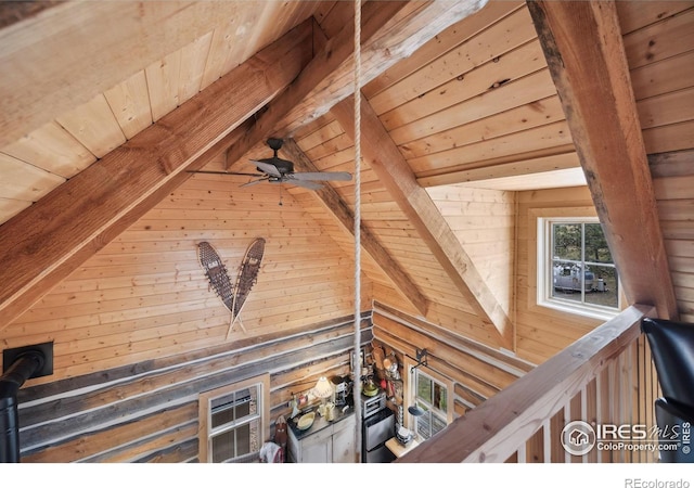 interior details featuring beamed ceiling, ceiling fan, and wooden ceiling