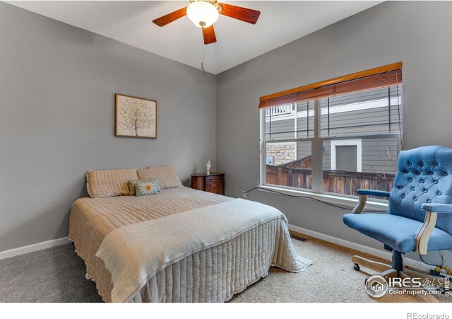 carpeted bedroom with ceiling fan