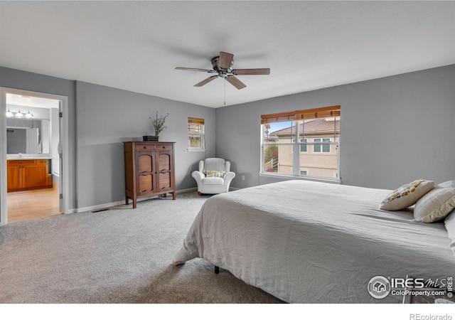 carpeted bedroom featuring ceiling fan and connected bathroom