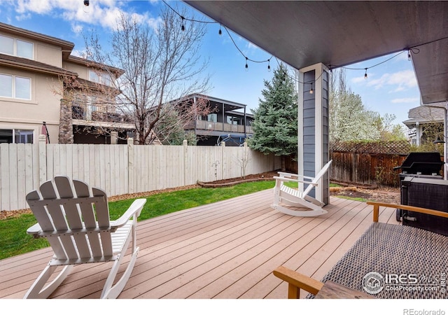 wooden deck with grilling area