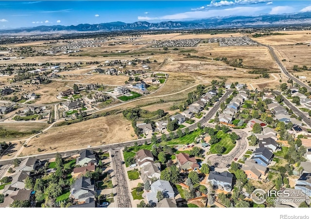 drone / aerial view featuring a mountain view