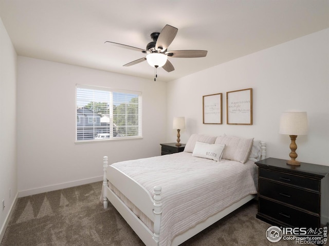 bedroom featuring dark colored carpet and ceiling fan