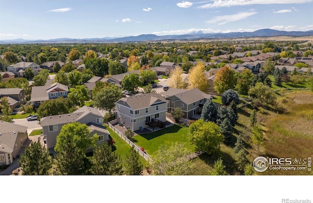 birds eye view of property with a mountain view