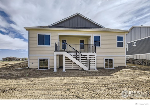 rear view of property with covered porch