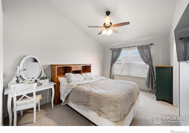 bedroom with ceiling fan, light colored carpet, and vaulted ceiling