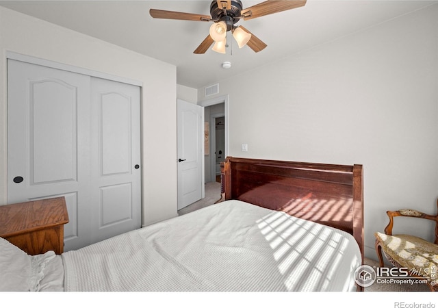 bedroom featuring ceiling fan and a closet