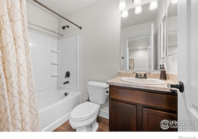 full bathroom with wood-type flooring, shower / bath combination with curtain, vanity, and toilet