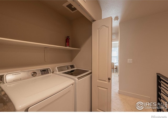 laundry room featuring washing machine and dryer