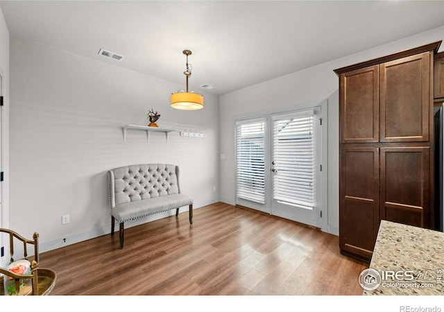 living area with hardwood / wood-style flooring