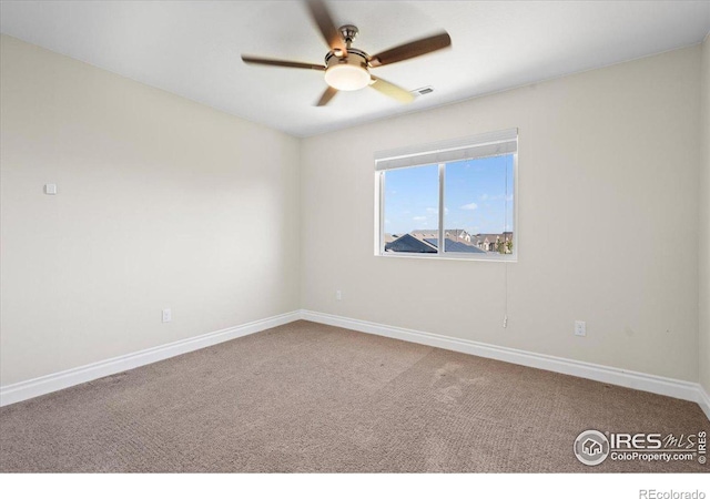 unfurnished room with carpet flooring and ceiling fan