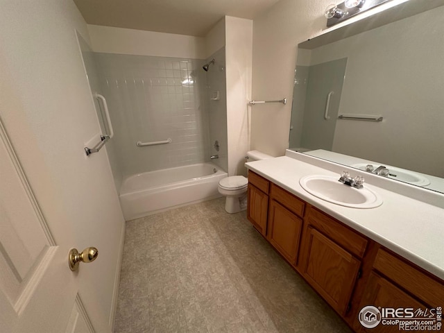 full bathroom featuring tiled shower / bath combo, vanity, and toilet