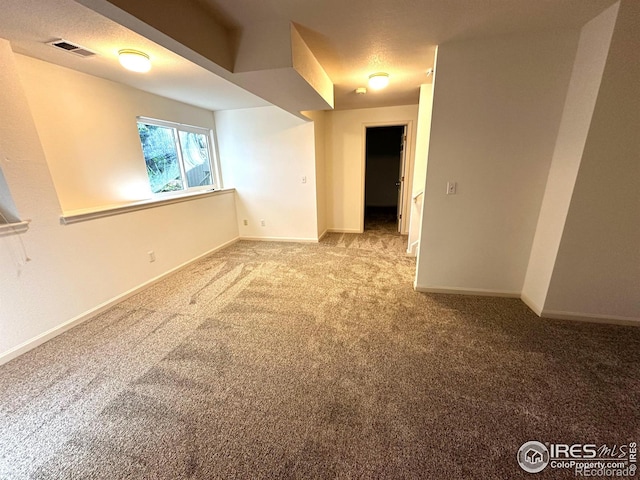 empty room with light colored carpet