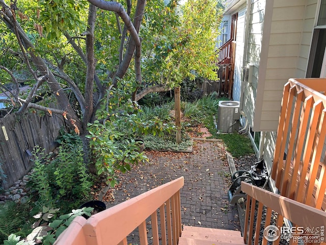 view of yard with a patio area and central AC