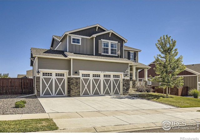 craftsman house with a garage