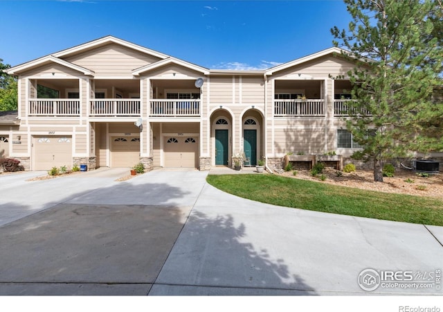 view of front of house featuring a balcony and a garage