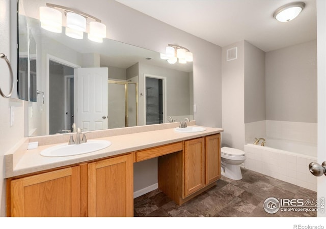 full bathroom featuring vanity, shower with separate bathtub, and toilet