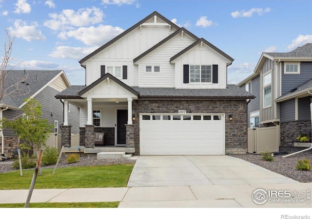 view of front of property featuring a garage and a front yard