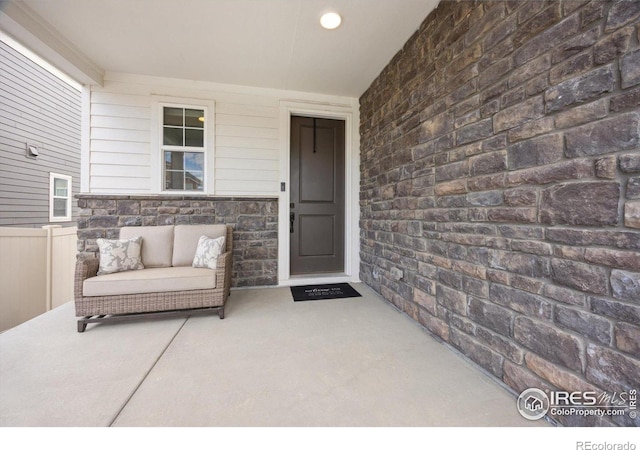 entrance to property with a patio area