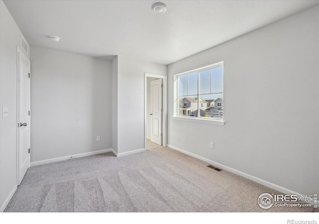 unfurnished bedroom with light carpet