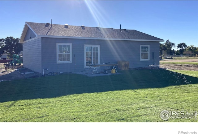 back of house featuring a yard and a patio area