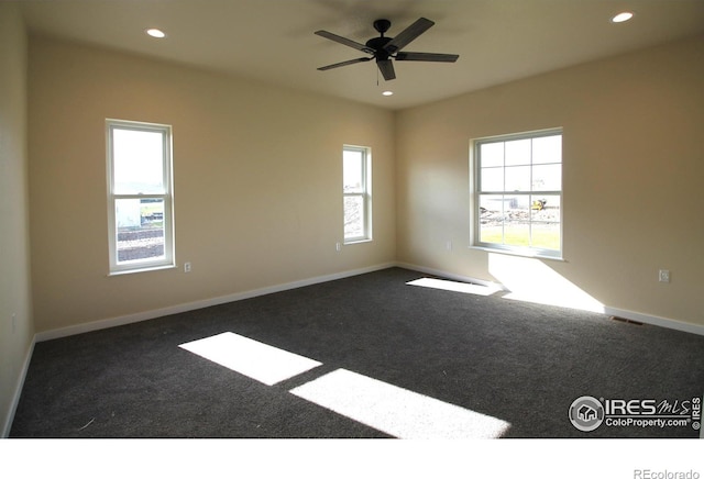 carpeted empty room featuring ceiling fan