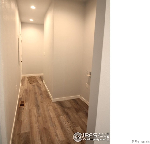 hallway featuring dark hardwood / wood-style flooring