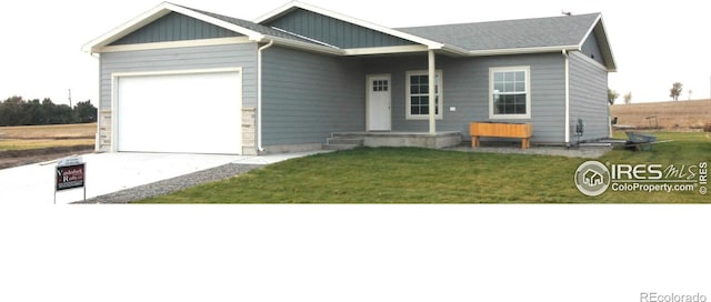 view of front of property with a garage and a front yard