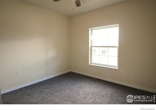 spare room with carpet and ceiling fan