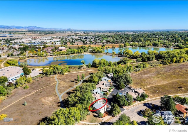 bird's eye view with a water and mountain view