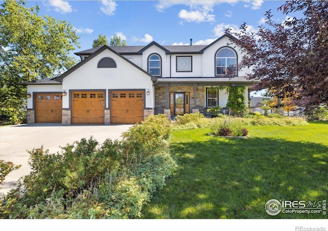 view of front of house with a garage and a front yard