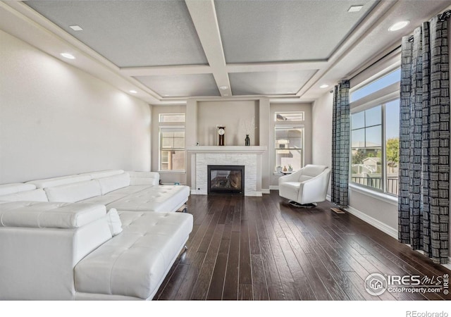 living area with recessed lighting, wood-type flooring, a tile fireplace, coffered ceiling, and baseboards