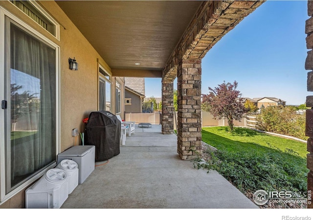 view of patio / terrace featuring fence and grilling area