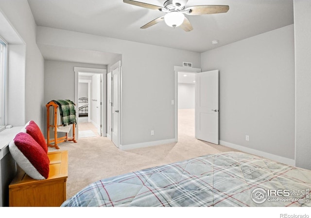 bedroom featuring ceiling fan and light carpet