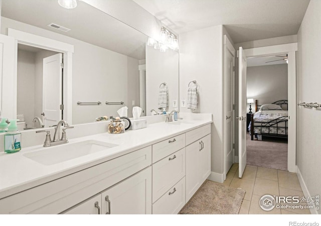 bathroom featuring tile patterned flooring and vanity