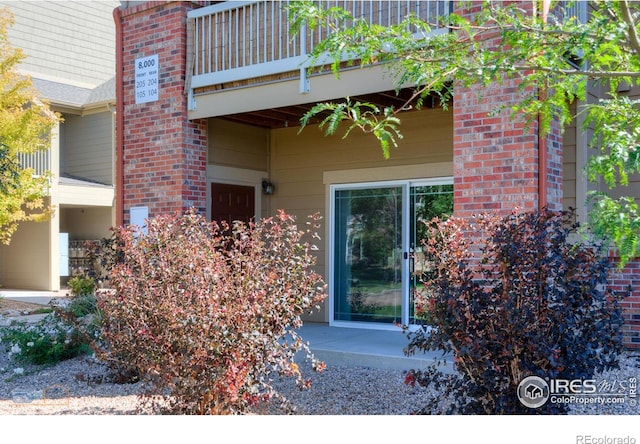 doorway to property with a balcony