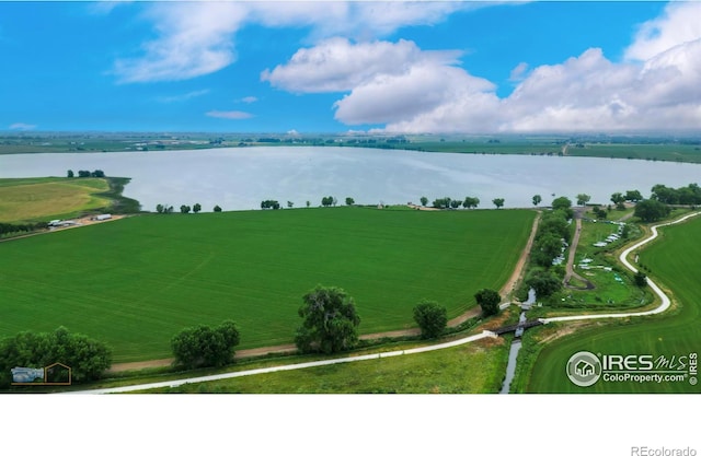 aerial view with a water view and a rural view