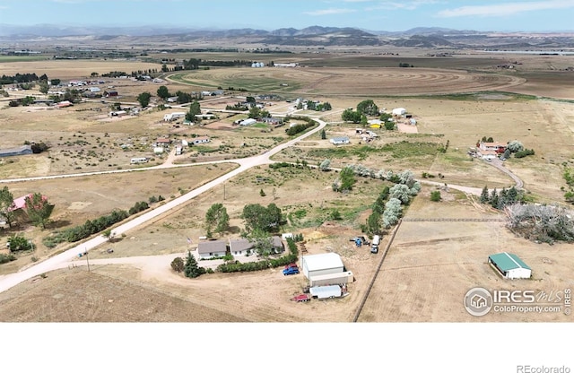 drone / aerial view featuring a rural view and a mountain view