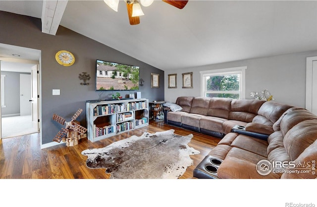 living room with a ceiling fan, lofted ceiling with beams, and wood finished floors