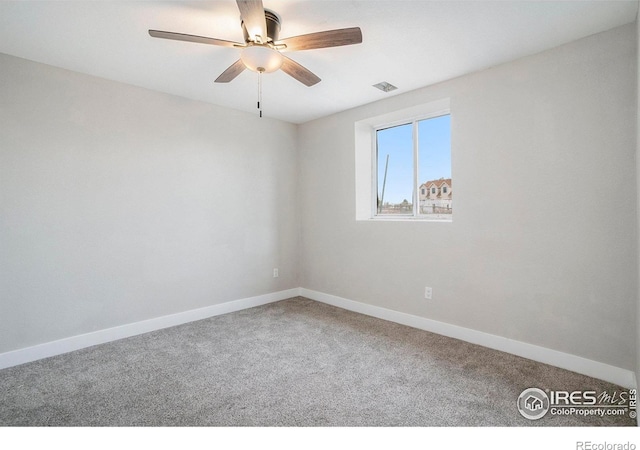 carpeted empty room with ceiling fan