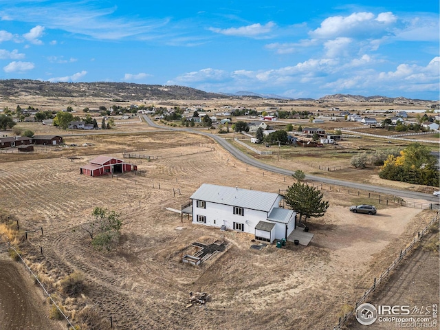 birds eye view of property featuring a mountain view