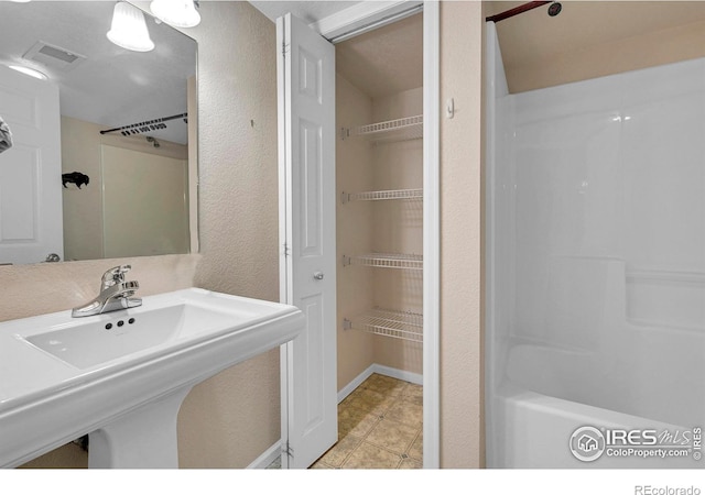 bathroom with sink and tile patterned floors