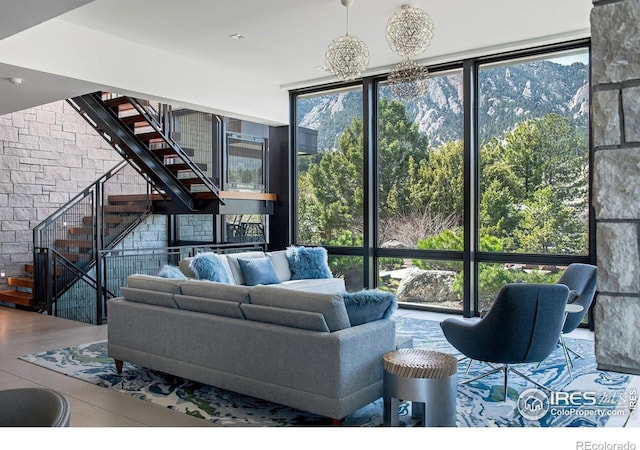 living room featuring floor to ceiling windows and hardwood / wood-style flooring